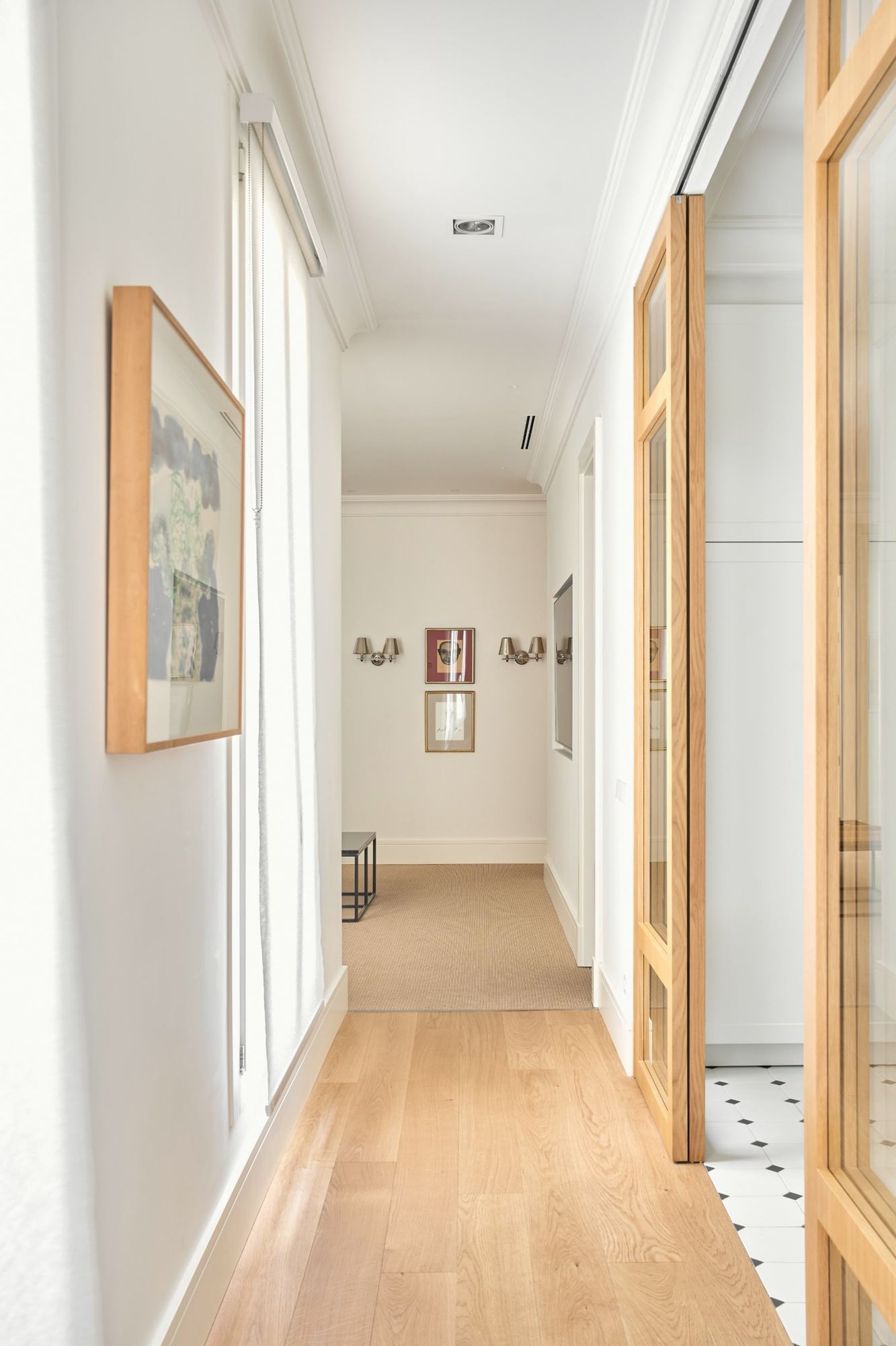 Corridor with oak floors and glazed oak doors opening to the kitchen