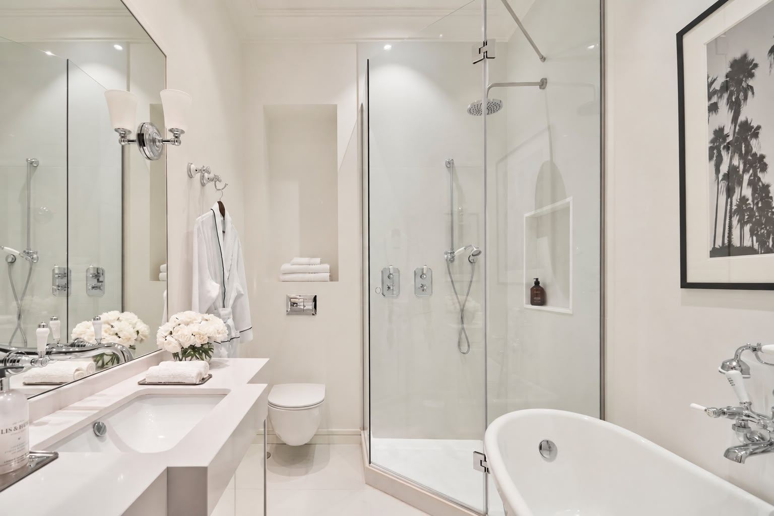 Suite bathroom with white freestanding bath and glass shower