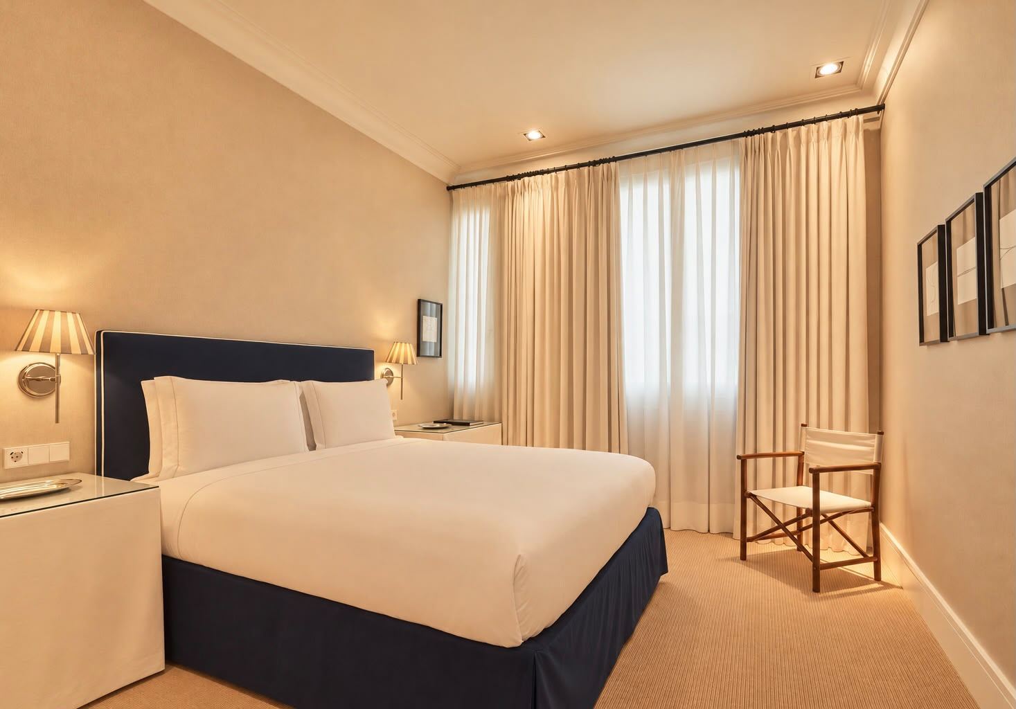Suite with navy upholstered headboard and director's chair